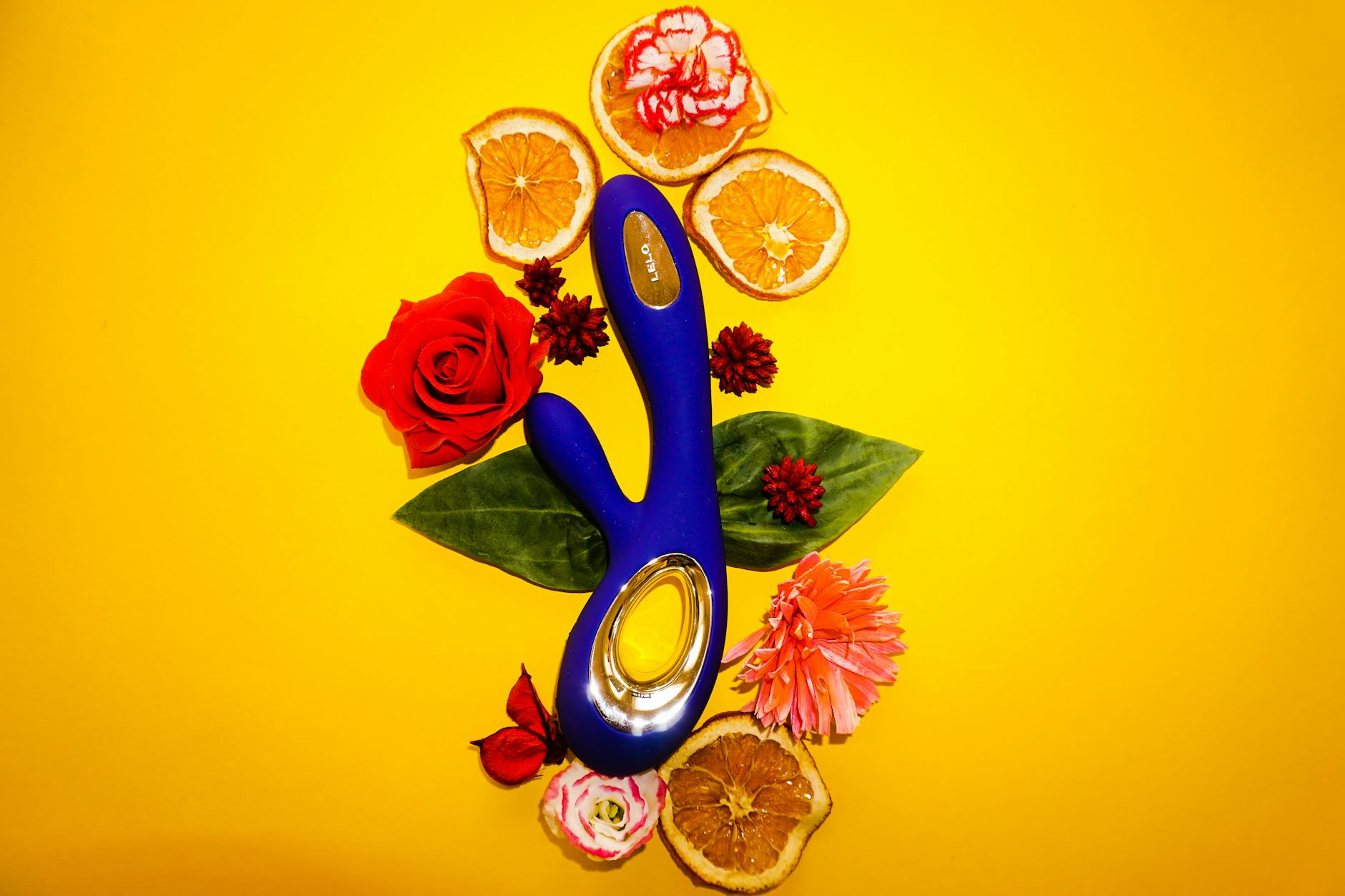 Fresh lemons on a white plate symbolizing the citrus-inspired design of pleasure tools